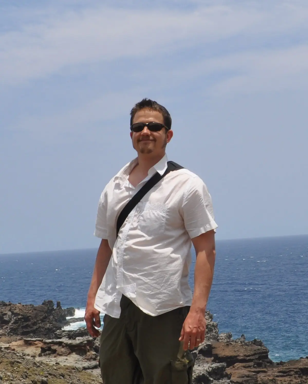 Marc W., founder of GTFO, standing on a rocky coast
